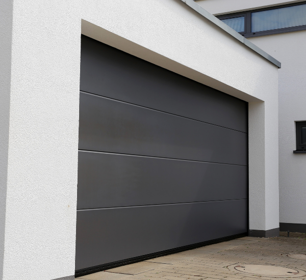 Professional technician performing precision garage door adjustments during maintenance service in San Francisco Bay Area