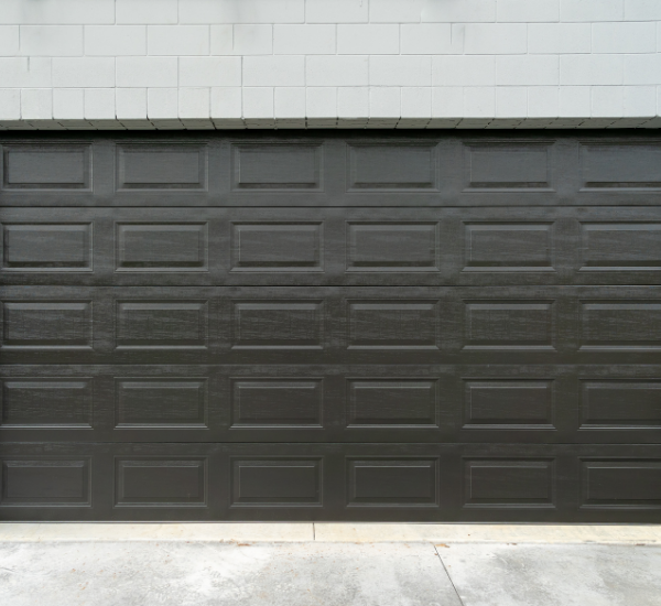 Professional technician performing comprehensive garage door lube and tune maintenance service in San Francisco Bay Area home
